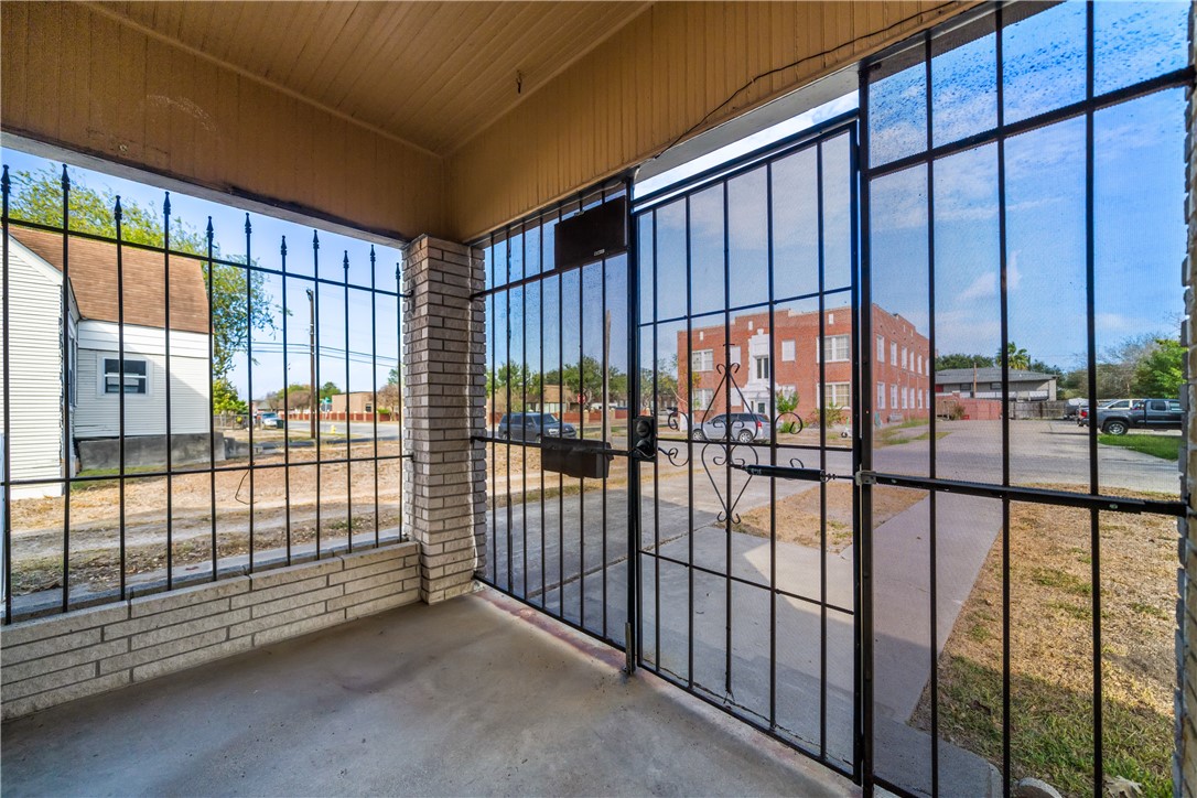 1205 10th Street Corpus Christi, TX 78404 - Photo 9 of 38 a view of a black and white gate