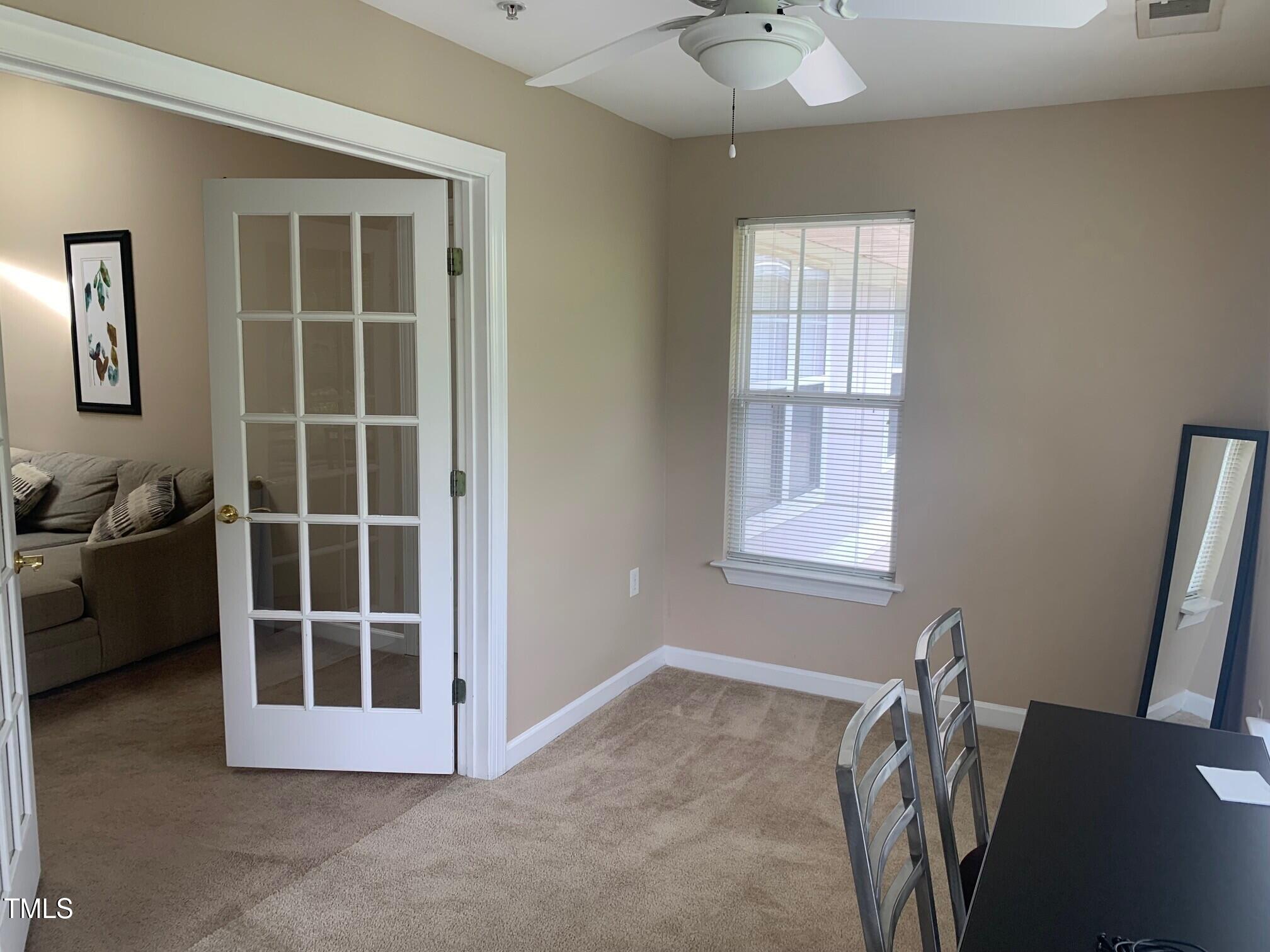 929 Morreene Road, Unit D34 Durham, NC 27705 - Photo 5 of 5 a view of an empty room with a window