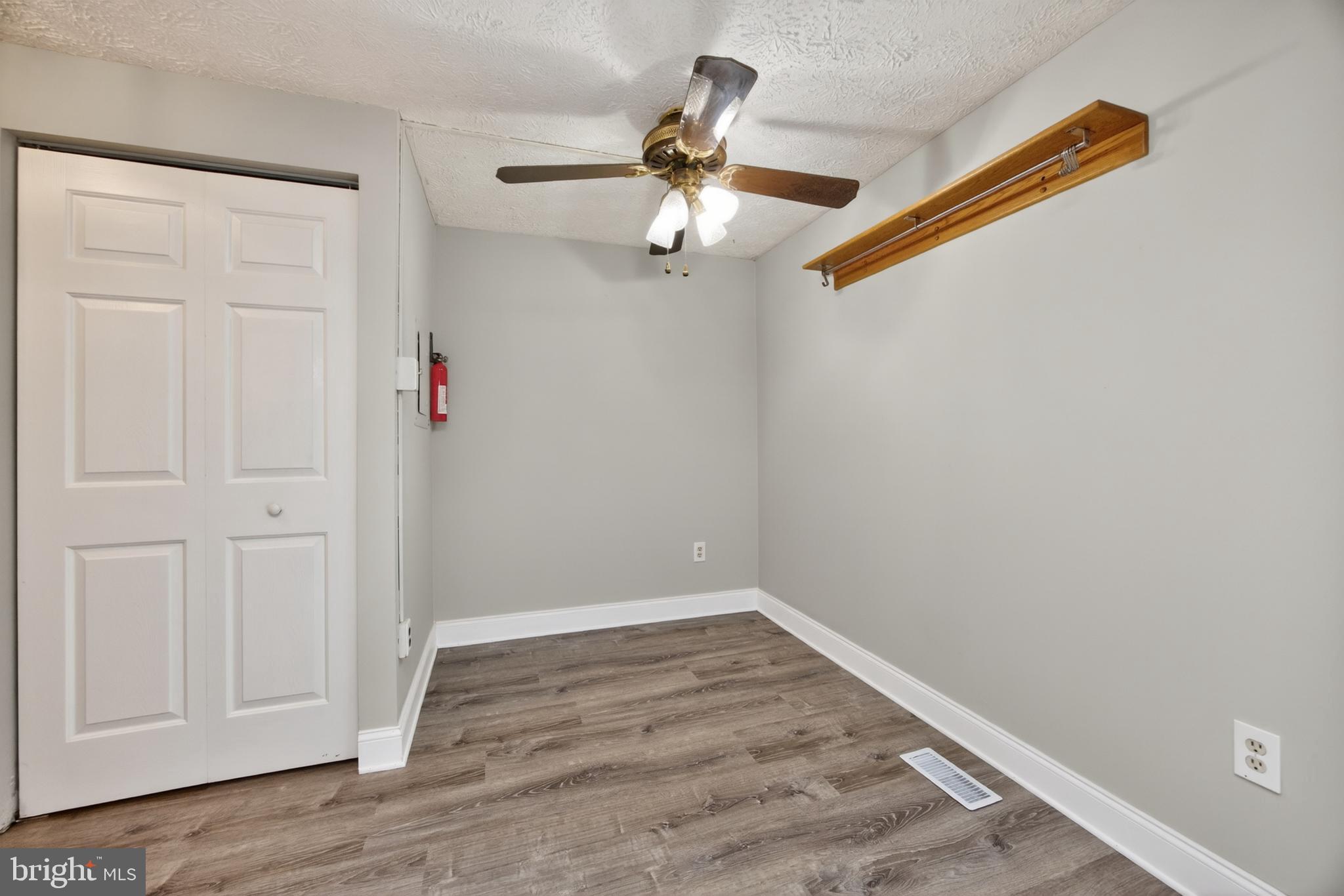 348 Barclay Street Coatesville, PA 19320 - Photo 11 of 28 wooden floor in an empty room