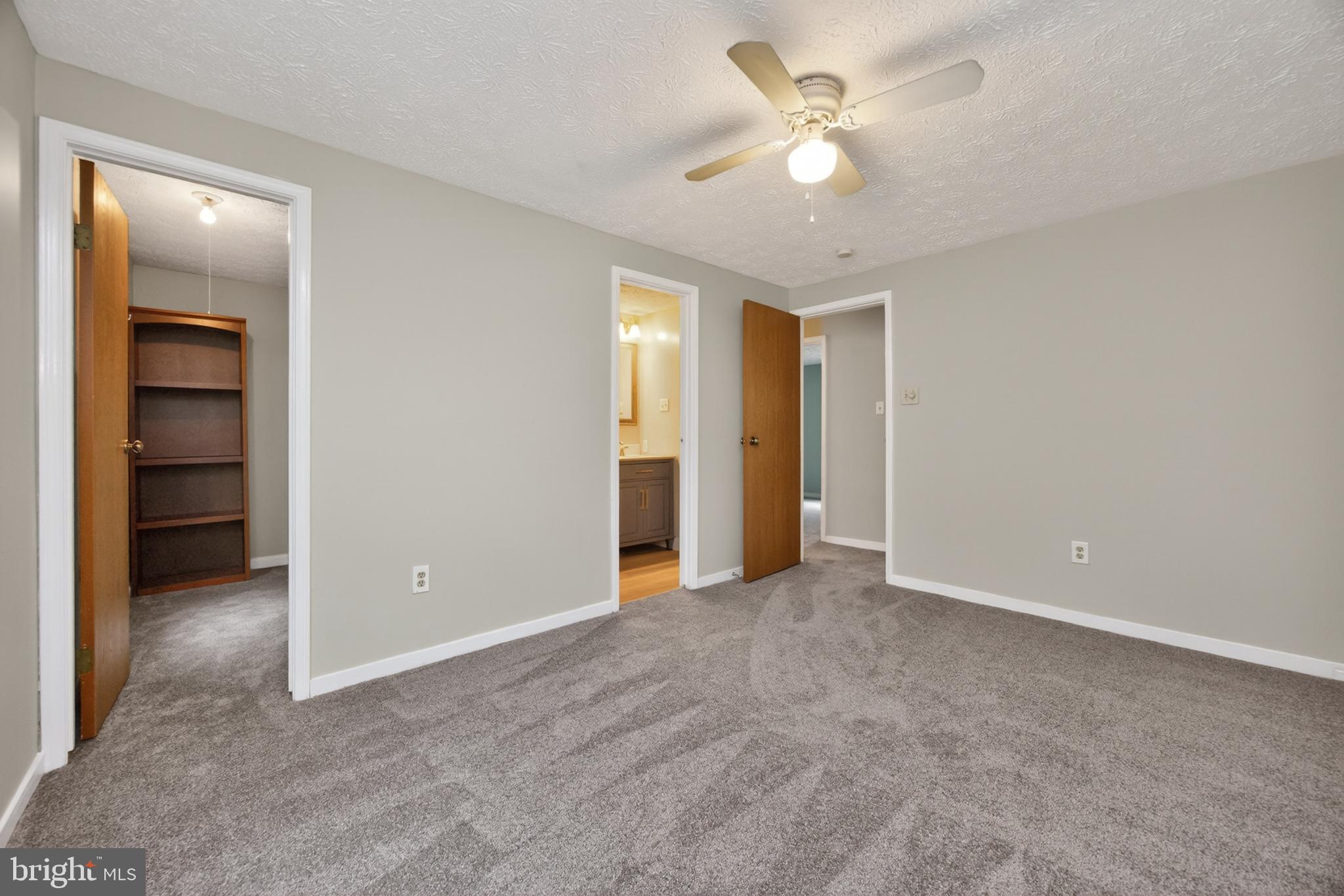 348 Barclay Street Coatesville, PA 19320 - Photo 14 of 28 an empty room with closet and a ceiling fan