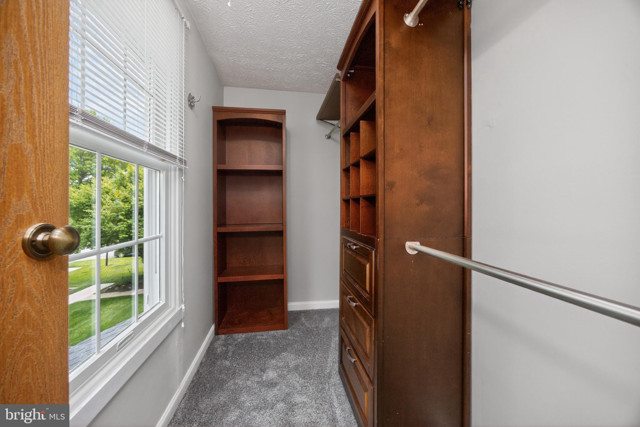348 Barclay Street Coatesville, PA 19320 - Photo 15 of 28 a view of walk in closet with empty racks