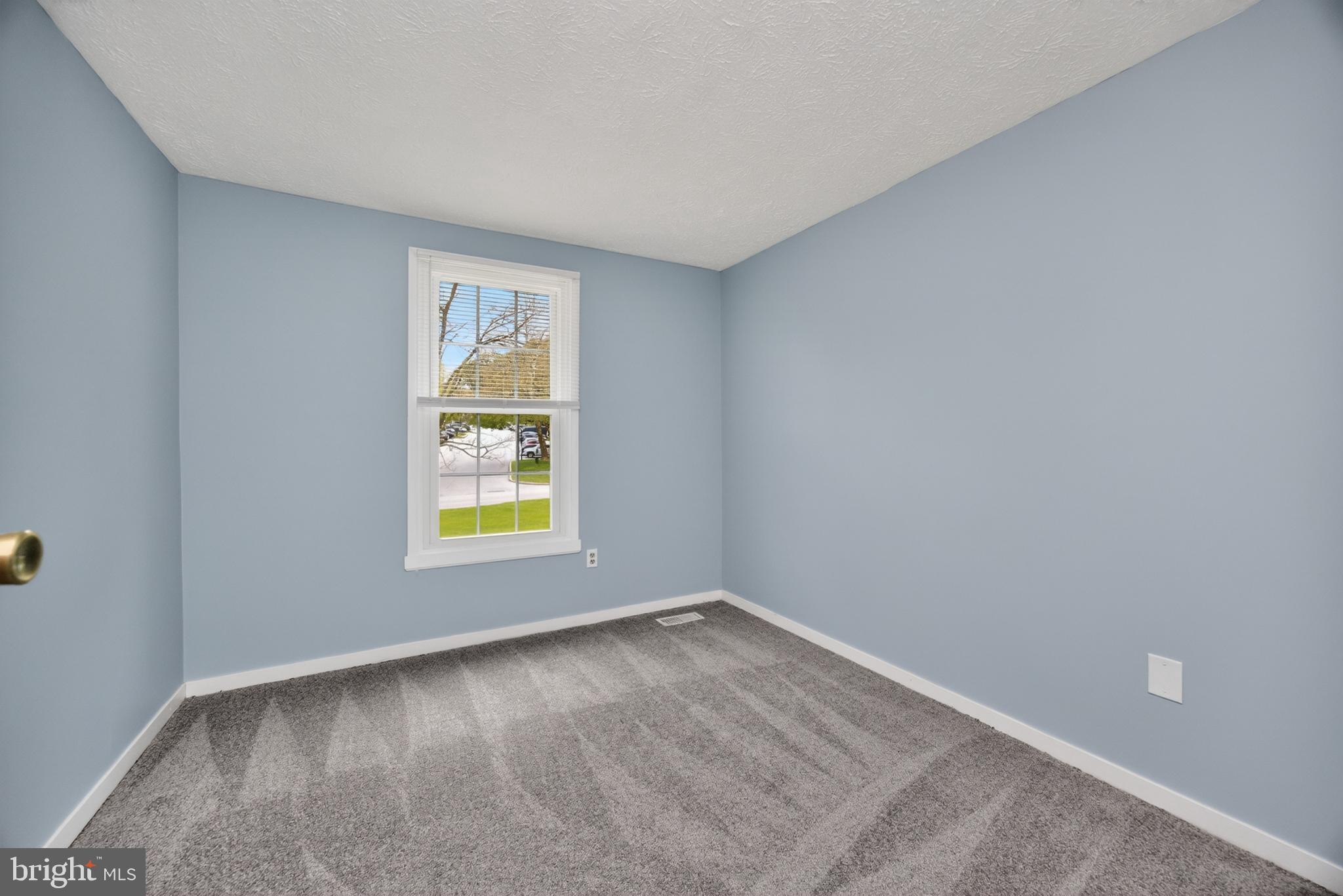 348 Barclay Street Coatesville, PA 19320 - Photo 20 of 28 wooden floor in an empty room with a window
