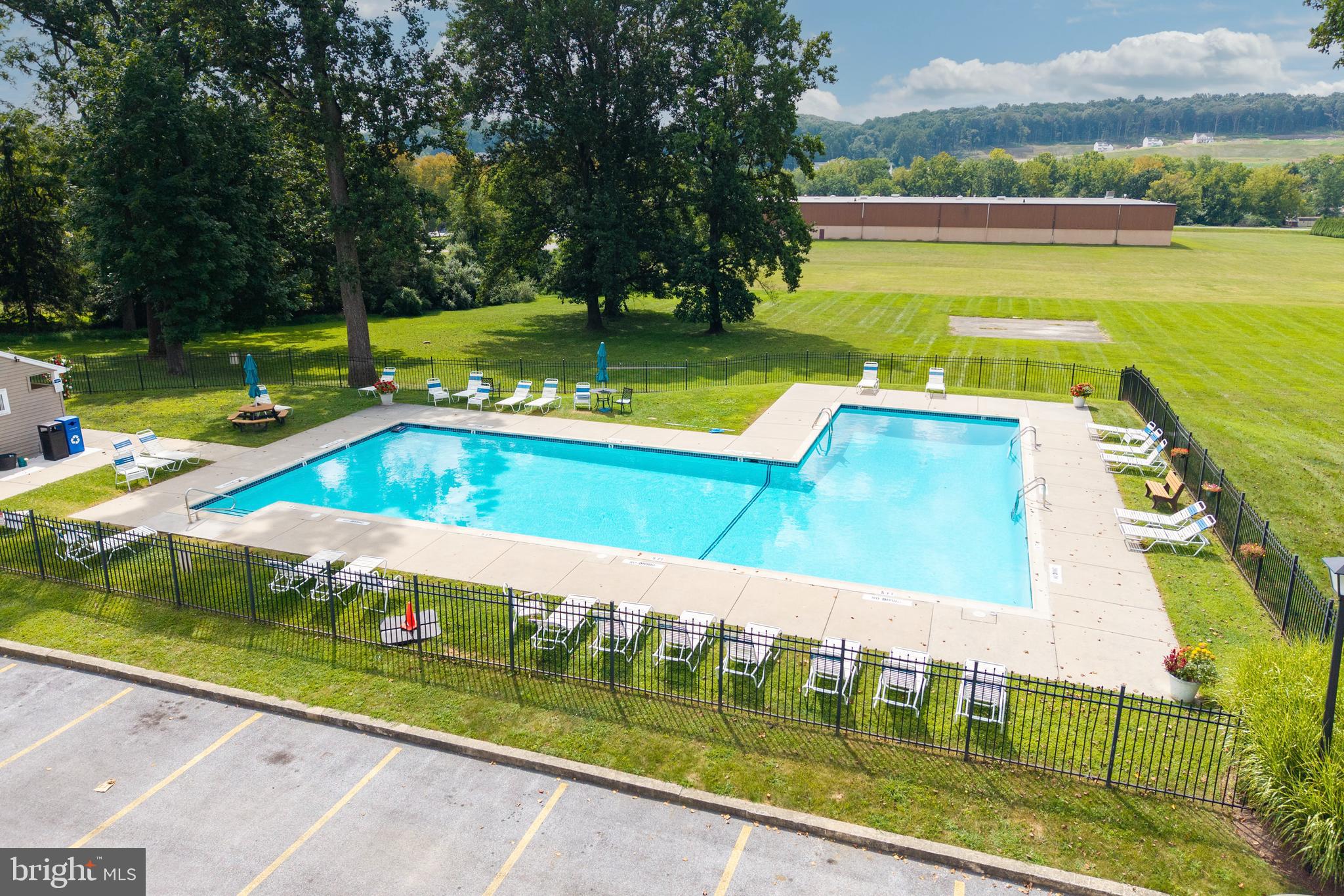 348 Barclay Street Coatesville, PA 19320 - Photo 23 of 28 a view of swimming pool with a garden and seating area