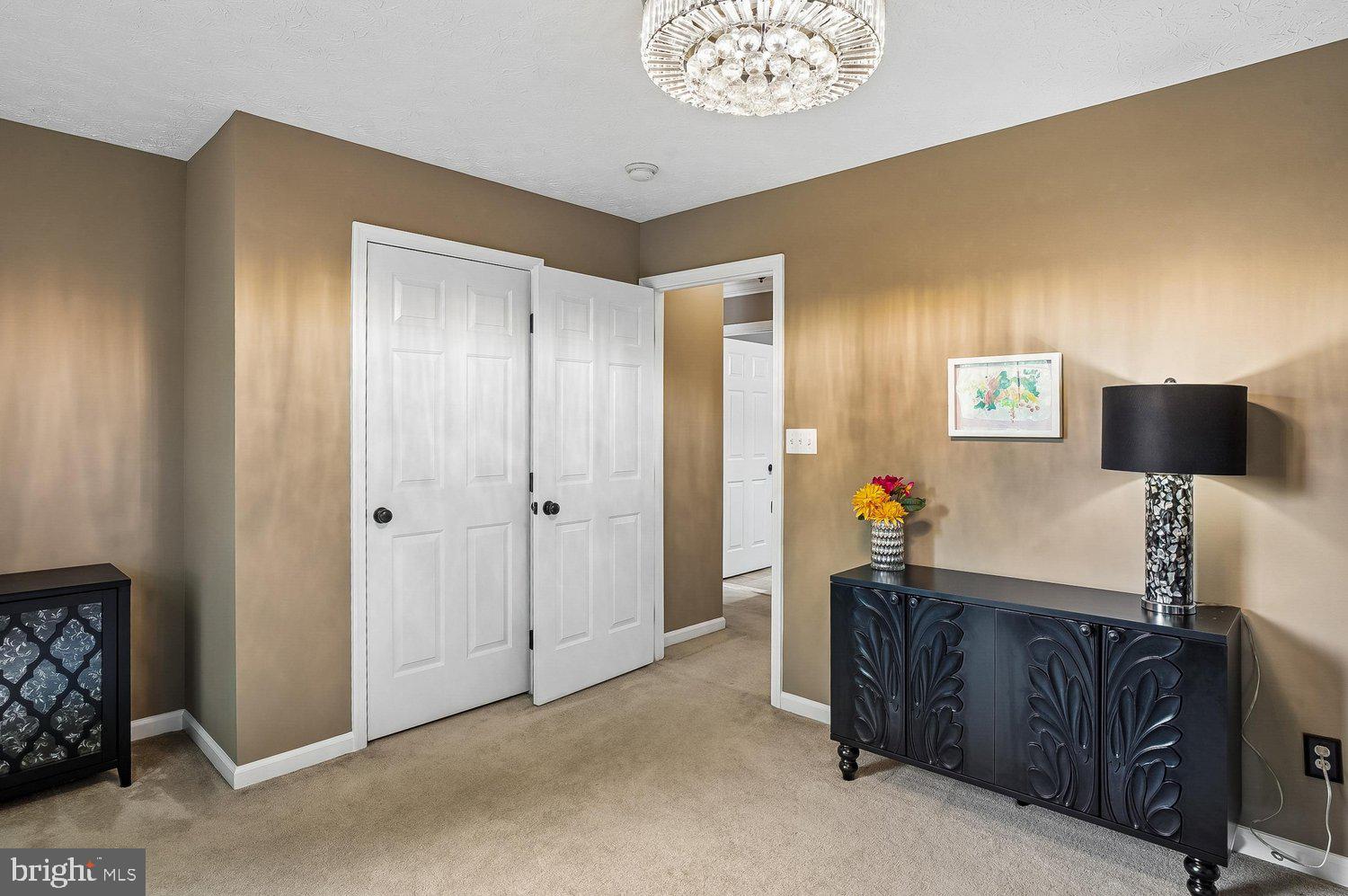 217 Raccoon Run Court Hanover, MD 21076 - Photo 21 of 38 a living room with furniture and a flat screen tv