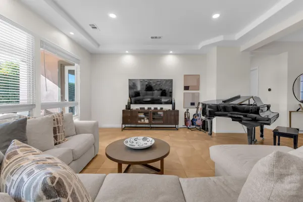 a view of a dining room with furniture and window