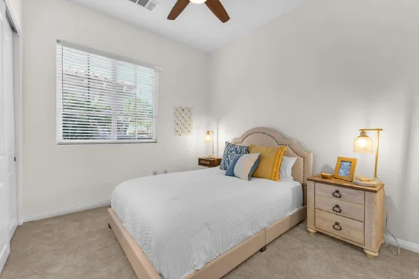 a view of a patio with a dining table and chairs with a patio