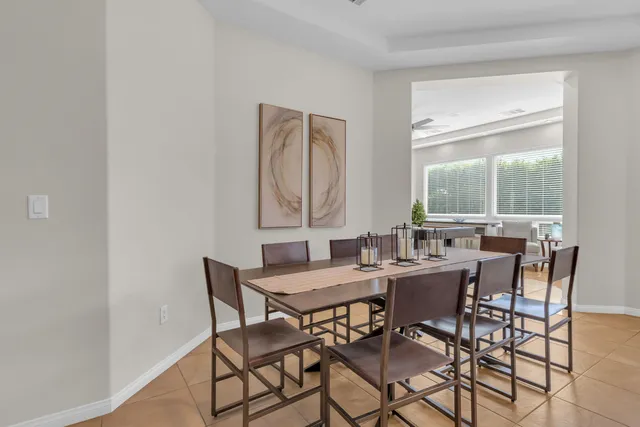 a bathroom with a granite countertop sink and a toilet