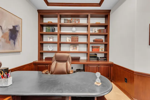 a bedroom with a bed and dresser