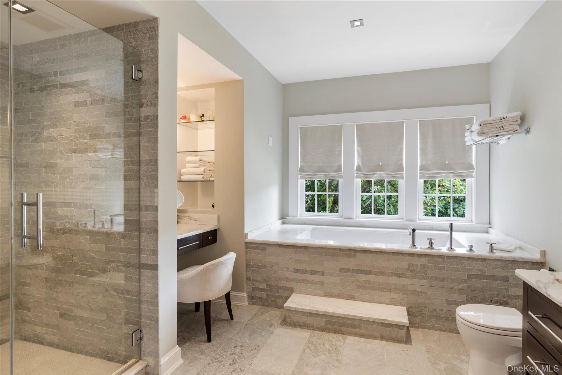 231 Flying Point Road Southampton, NY 11968 - Photo 18 of 34 Full bathroom with vanity, a bath, and a stall shower