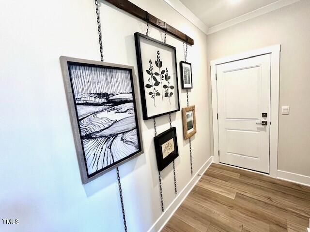 11549 Helmond Way, Unit 117 Raleigh, NC 27617 - Photo 16 of 34 a view of a hallway with wooden floor and staircase