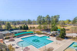 11549 Helmond Way, Unit 117 Raleigh, NC 27617 - Photo 25 of 34 a view of a swimming pool with a patio and a yard