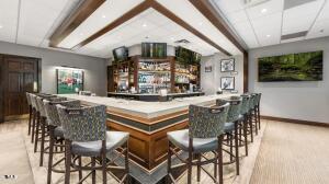 11549 Helmond Way, Unit 117 Raleigh, NC 27617 - Photo 26 of 34 a view of a dining room with furniture and wooden floor