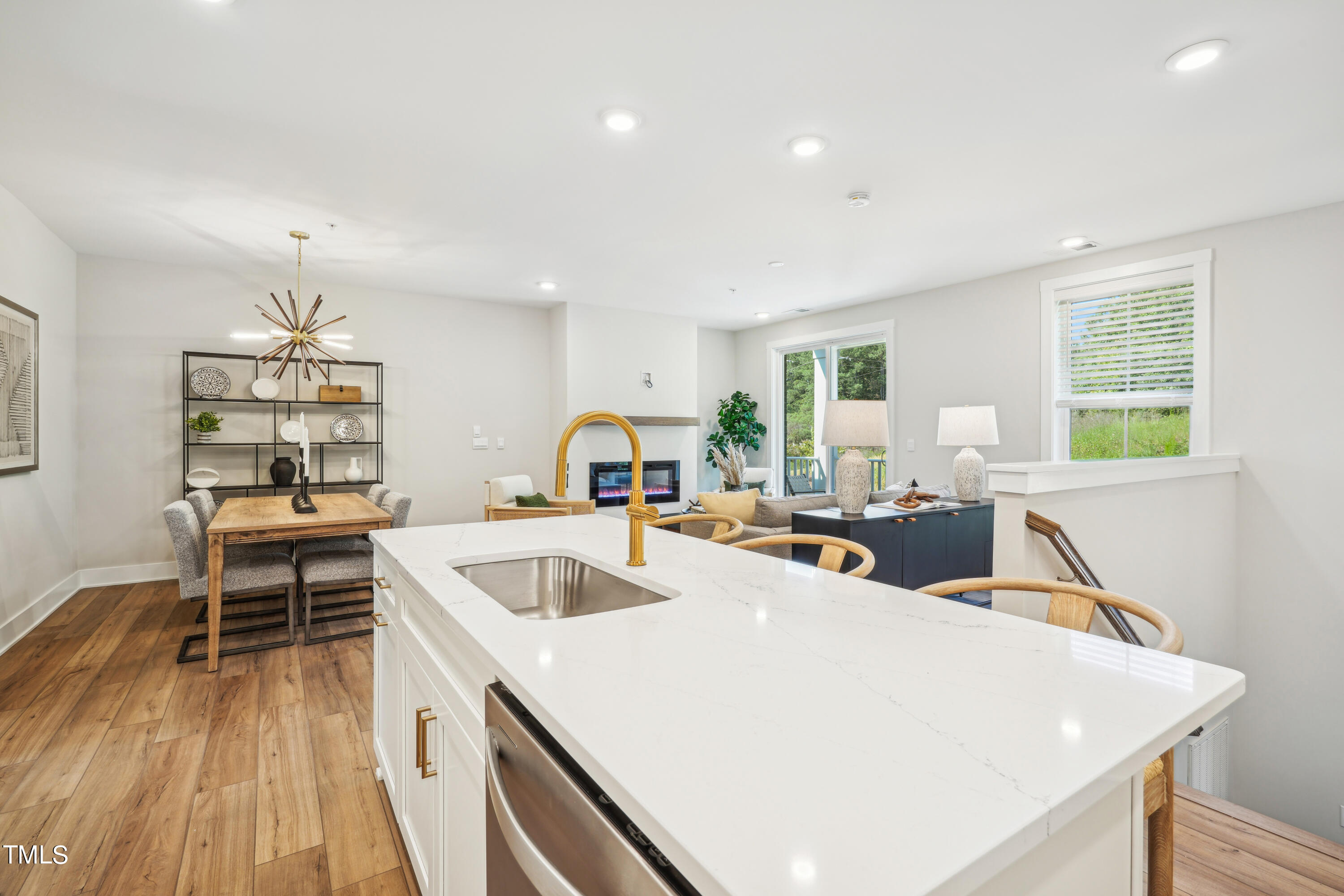 11549 Helmond Way, Unit 117 Raleigh, NC 27617 - Photo 4 of 34 a view of kitchen and wooden floor