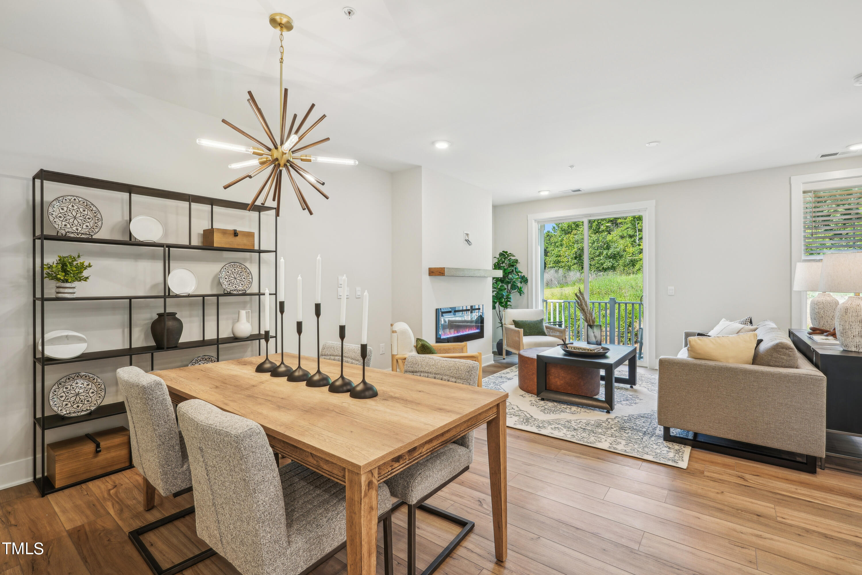 11549 Helmond Way, Unit 117 Raleigh, NC 27617 - Photo 5 of 34 a living room with furniture a window and a table
