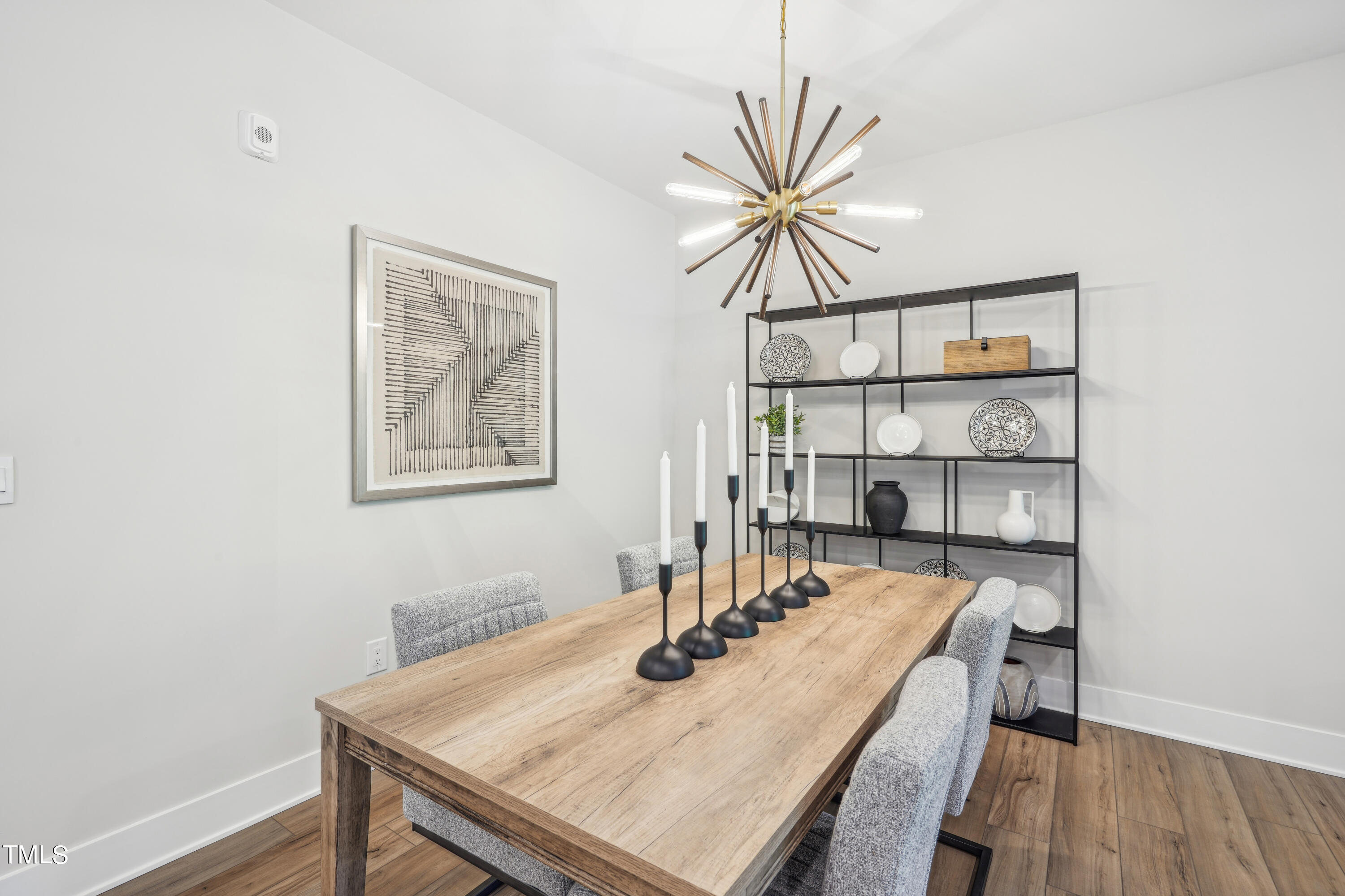 11549 Helmond Way, Unit 117 Raleigh, NC 27617 - Photo 9 of 34 a view of a dining room with furniture and wooden floor