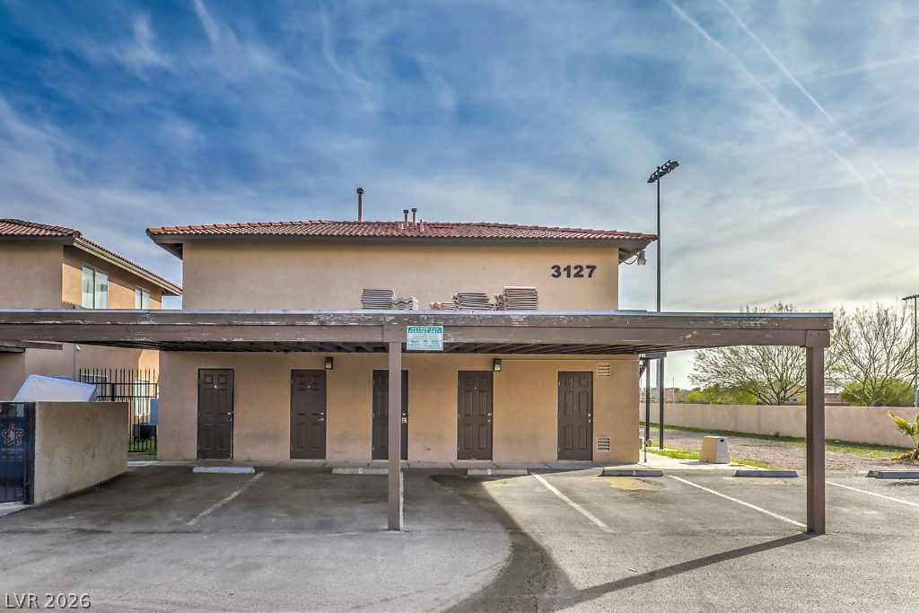 3127 North Walnut Road, Unit A Las Vegas, NV 89115 - Photo 3 of 12 A well-maintained stucco exterior with a tiled roof provides durable curb appeal.