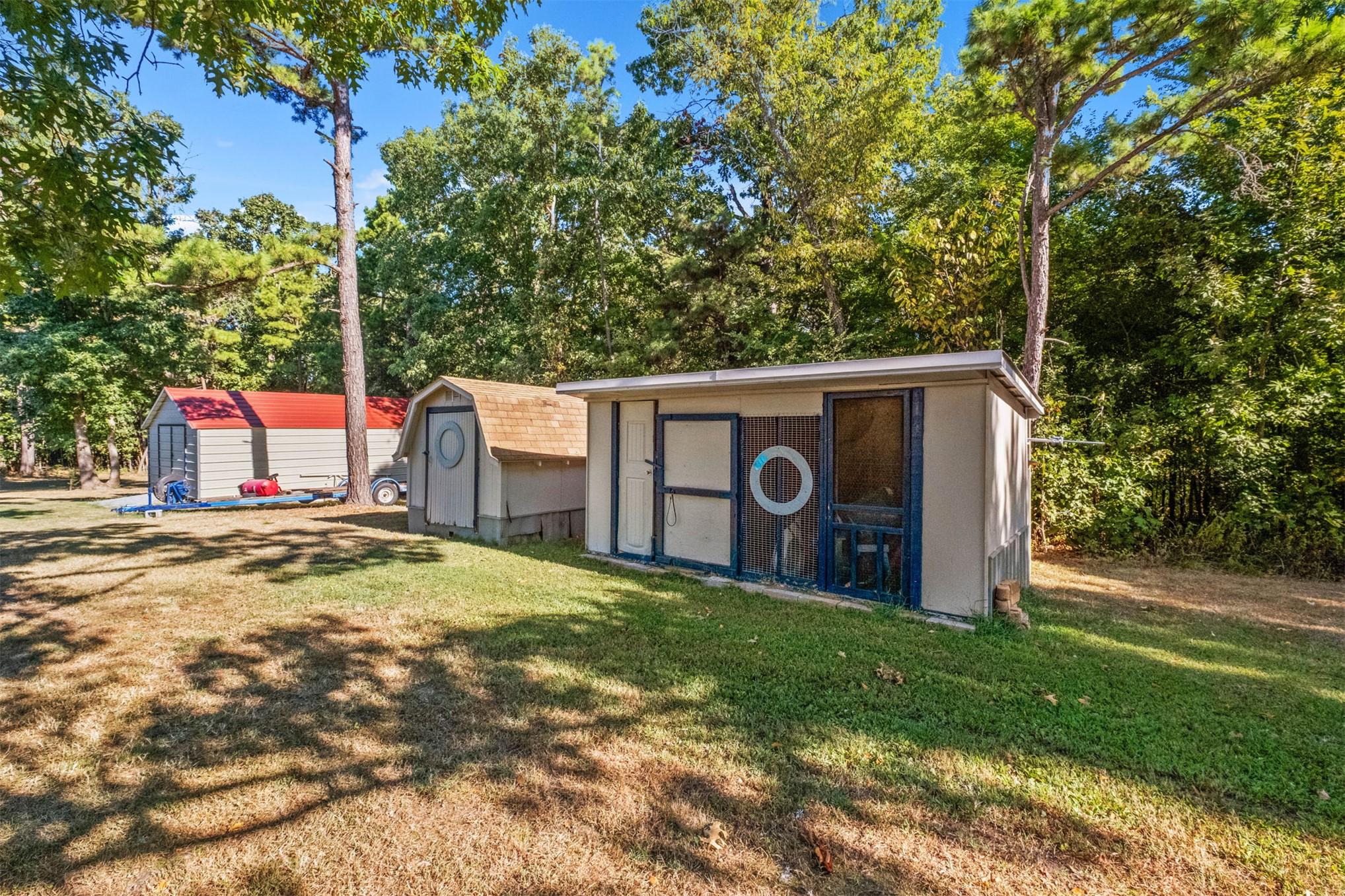 57443 667th Colcord, OK 74338 - Photo 33 of 51 Multiple storage sheds on a verdant lot