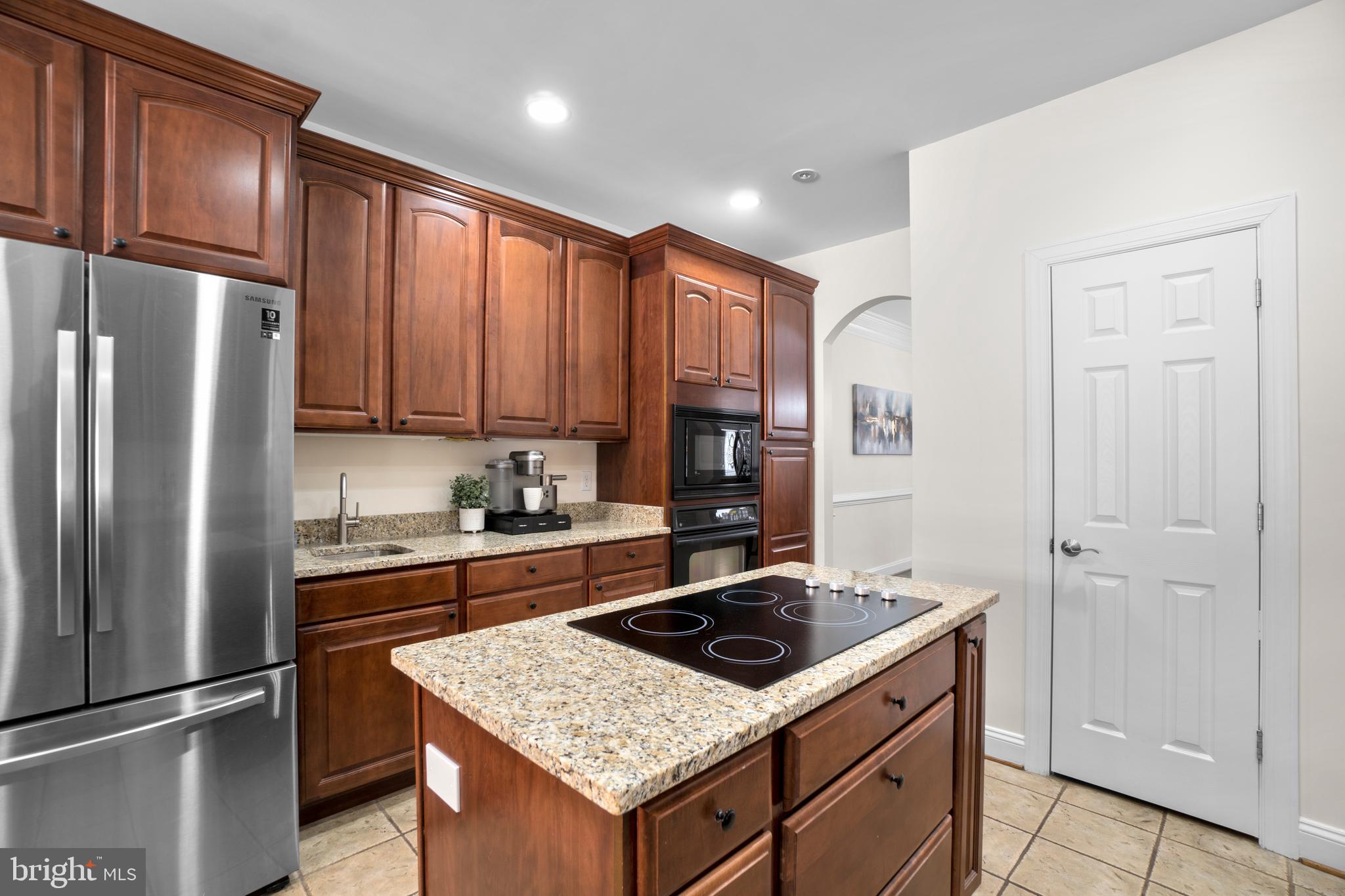 21877 Boonsboro Mountain Road Boonsboro, MD 21713 - Photo 13 of 62 a kitchen with a stove a refrigerator and a sink