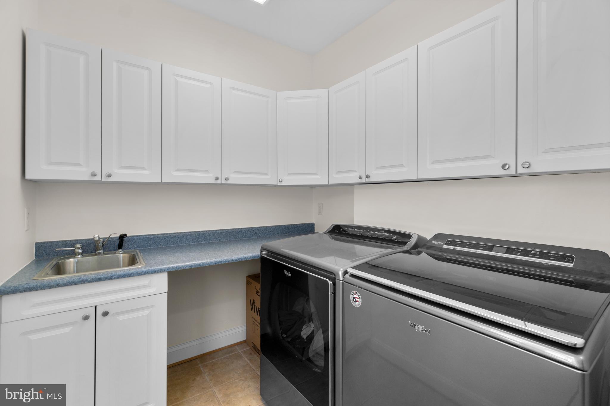 21877 Boonsboro Mountain Road Boonsboro, MD 21713 - Photo 16 of 62 a kitchen with white cabinets and a stove top oven