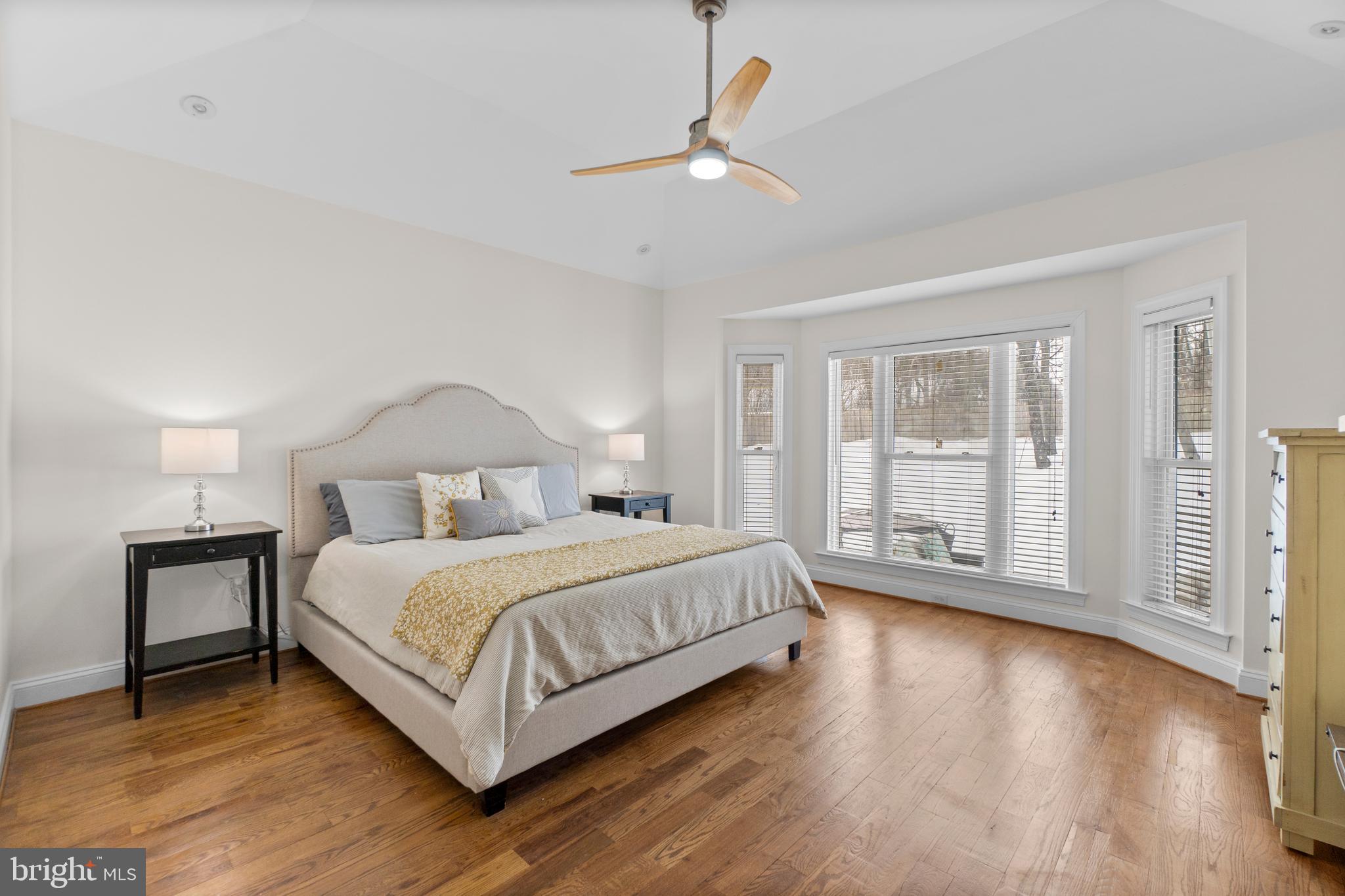 21877 Boonsboro Mountain Road Boonsboro, MD 21713 - Photo 22 of 62 a bedroom with a large bed and a chandelier