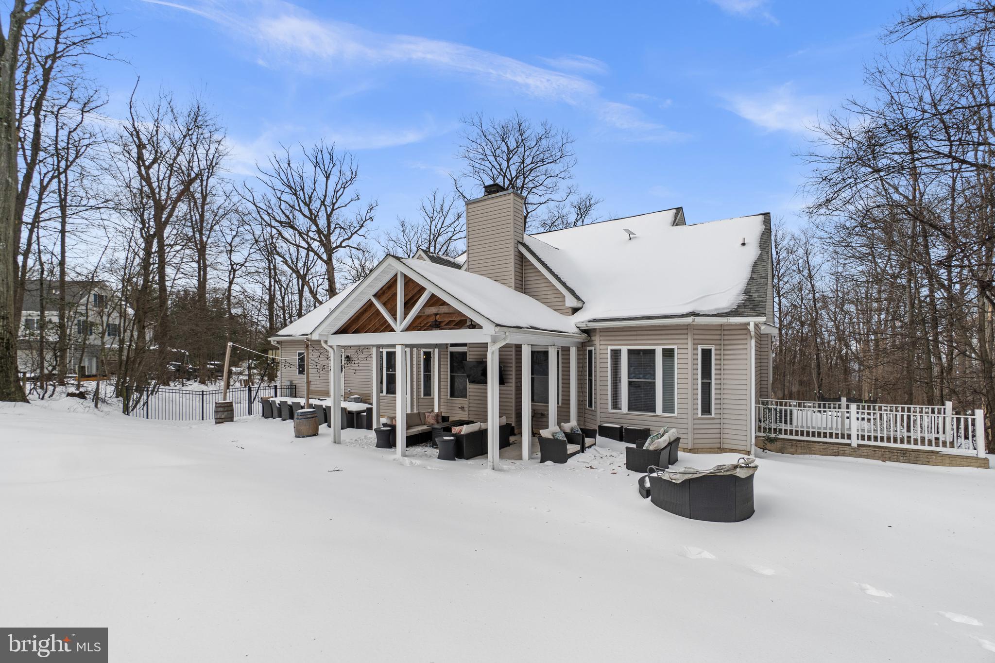 21877 Boonsboro Mountain Road Boonsboro, MD 21713 - Photo 53 of 62 a view of a white house with a yard covered in snow