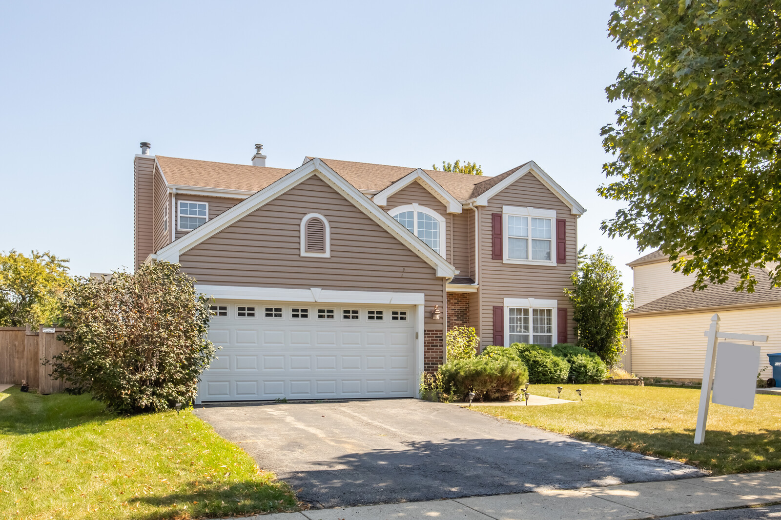 207 Faircroft Road Bartlett, IL 60103 - Photo 2 of 29 a view of yellow house with a yard and plants