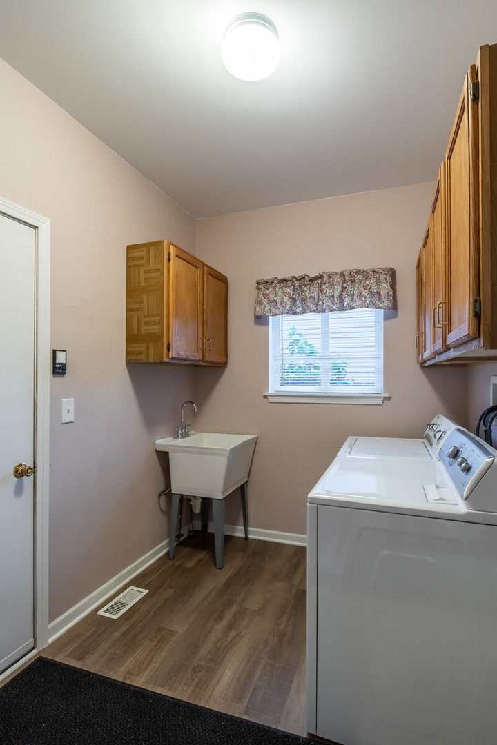 207 Faircroft Road Bartlett, IL 60103 - Photo 13 of 29 a room with a table chairs and wooden floor