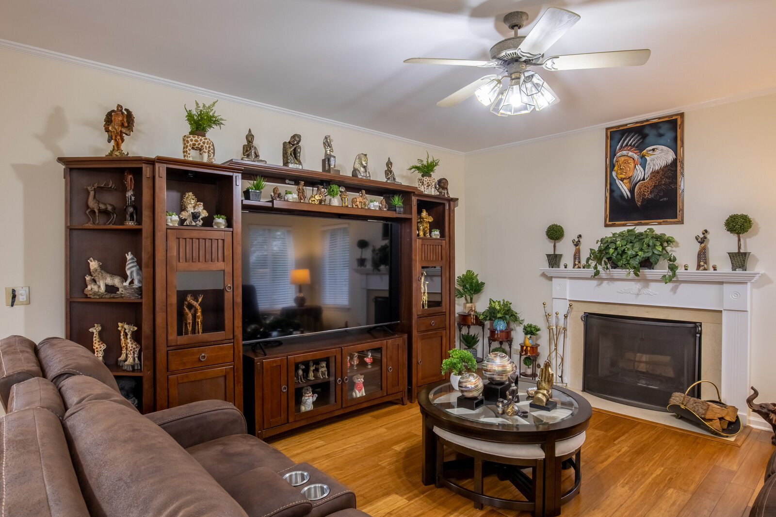 207 Faircroft Road Bartlett, IL 60103 - Photo 21 of 29 a living room with furniture a flat screen tv and a fireplace