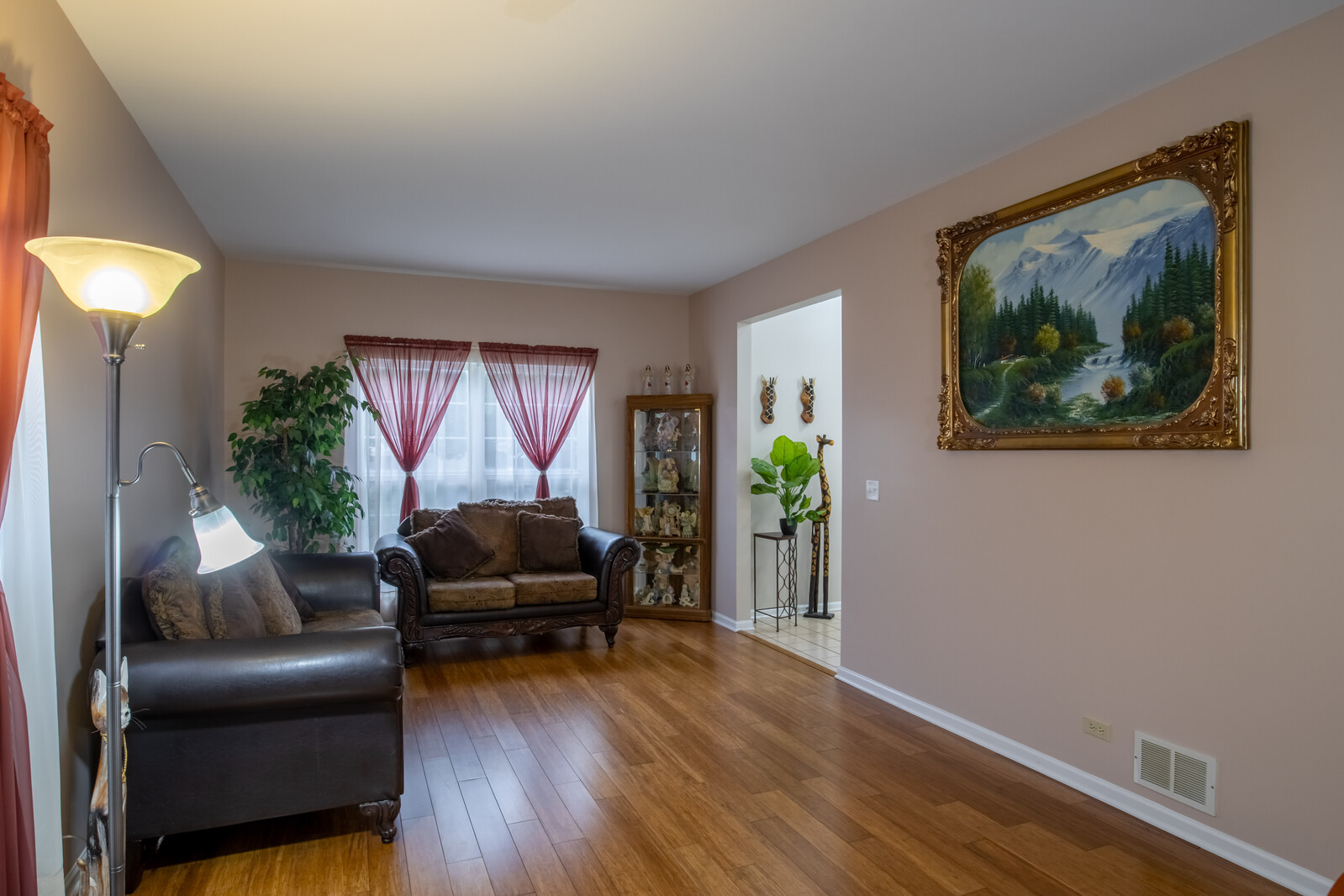 207 Faircroft Road Bartlett, IL 60103 - Photo 24 of 29 a living room with furniture and a wooden floor