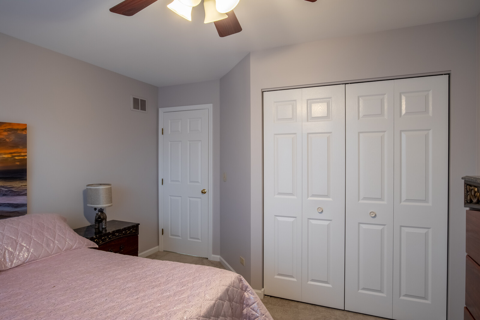 207 Faircroft Road Bartlett, IL 60103 - Photo 8 of 29 a bedroom with a bed and a chandelier fan