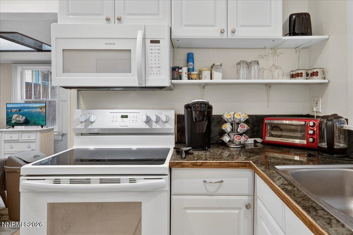 611 Nixon Avenue Reno, NV 89509 - Photo 18 of 43 a stove top oven sitting inside of a kitchen