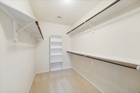 a view of an empty walk in closet