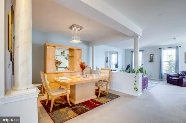 a view of a dining room with furniture and window