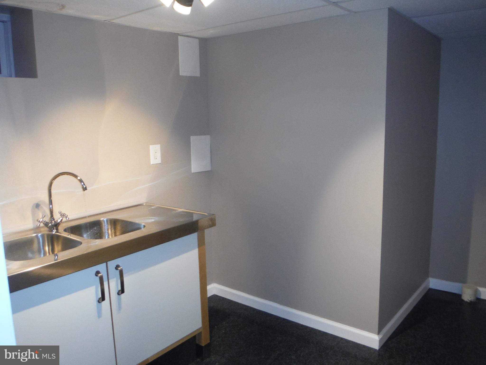 219 Arundel Road Pasadena, MD 21122 - Photo 19 of 26 west bar in basement
