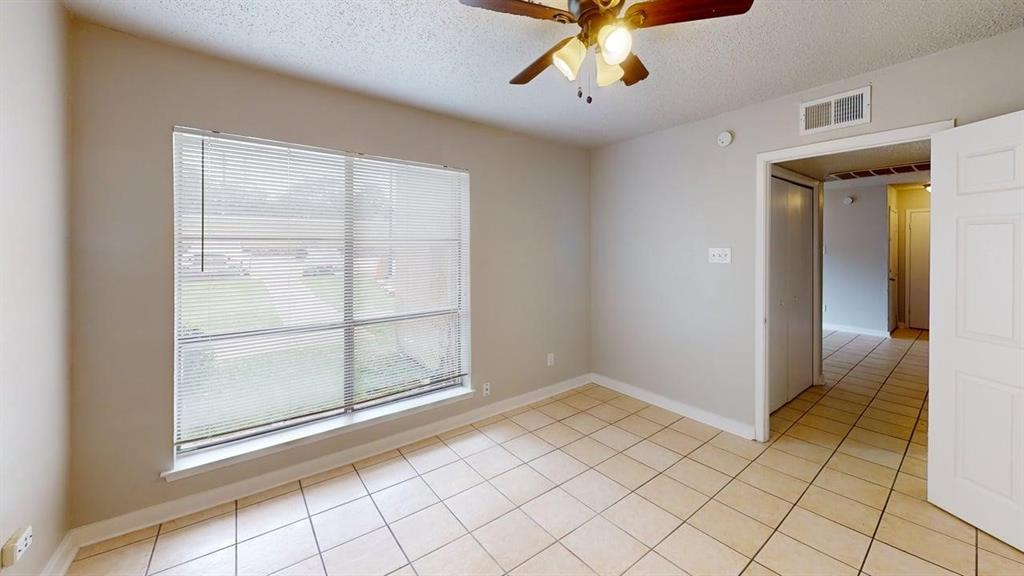 8110 Skillman Street, Unit 1046 Dallas, TX 75231 - Photo 7 of 10 a view of an empty room with a window