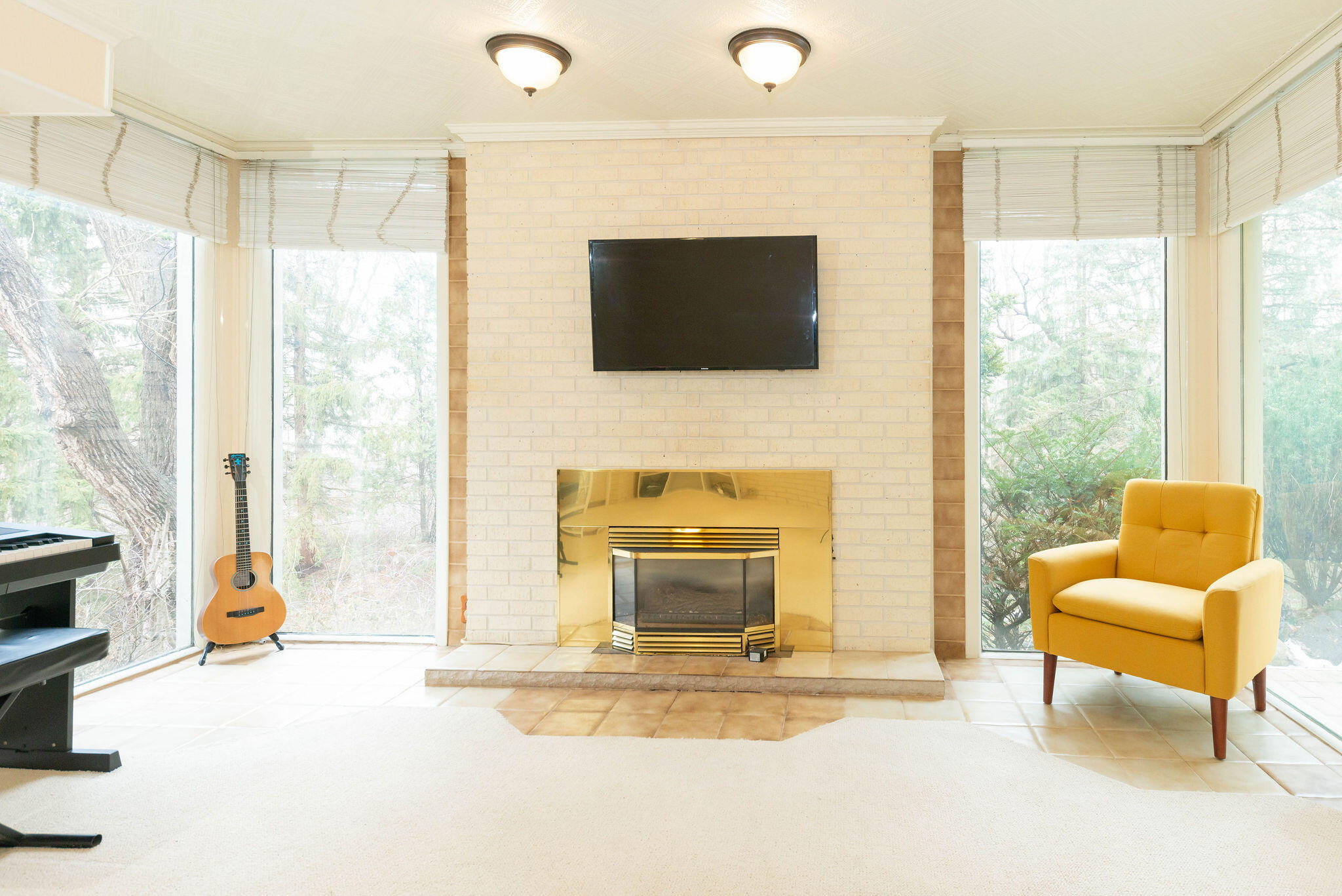 N11W31386 Fairfield Way Delafield, WI 53018 - Photo 30 of 71 Awesome downstairs fireplace perfect for warming up and looking out at the deer. This is the window they like to look in.