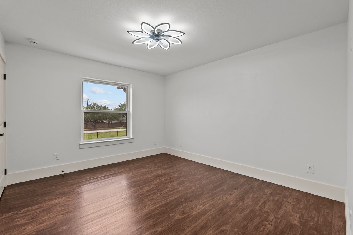 3237 Harkey Road Pearland, TX 77584 - Photo 25 of 46 One of four additional bedrooms as you enter the upstairs floor