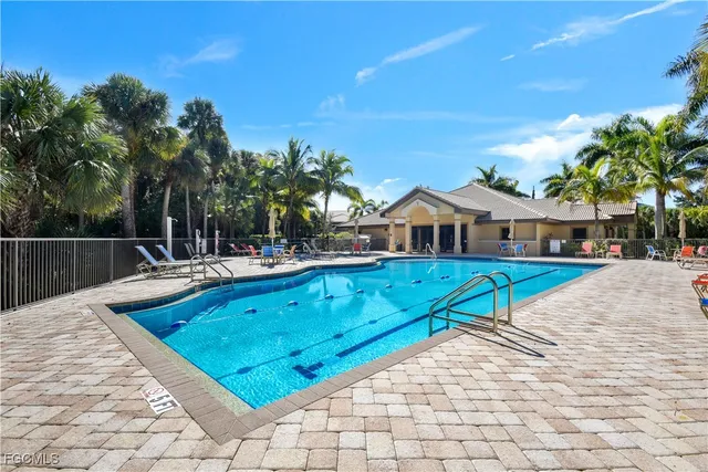 a view of swimming pool with lounge chair