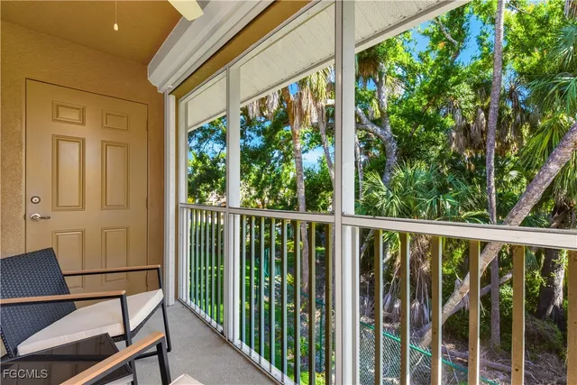 a view of a balcony with chairs