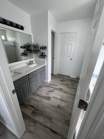 14010 Hawksnest Bay Drive Corpus Christi, TX 78418 - Photo 11 of 22 a bathroom with a sink a mirror and a shower