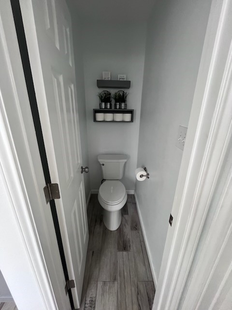 14010 Hawksnest Bay Drive Corpus Christi, TX 78418 - Photo 13 of 22 a bathroom with a toilet and a sink