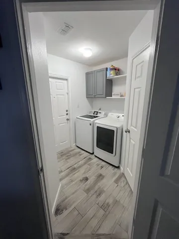 a view of a kitchen with a sink dishwasher stove and refrigerator
