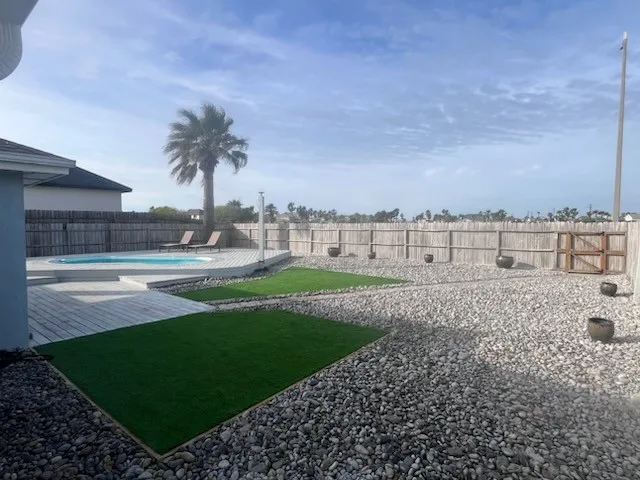 a view of a big yard with a house