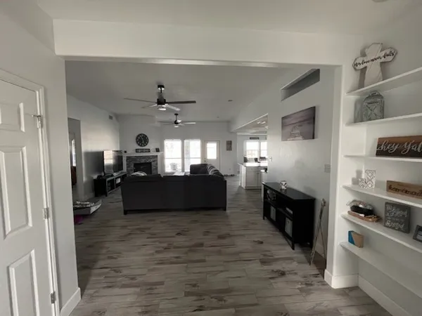 a living room with furniture and a fireplace