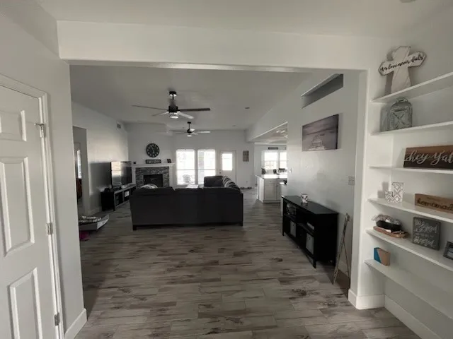 a living room with furniture and a fireplace