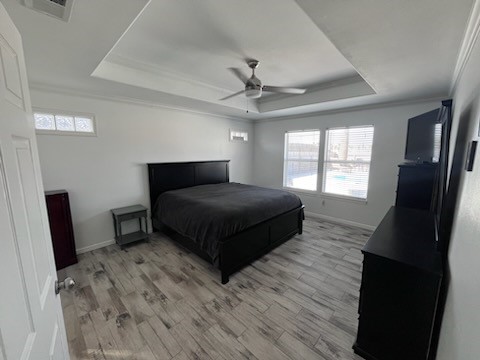 14010 Hawksnest Bay Drive Corpus Christi, TX 78418 - Photo 9 of 22 a bedroom with a bed a mirror and a window