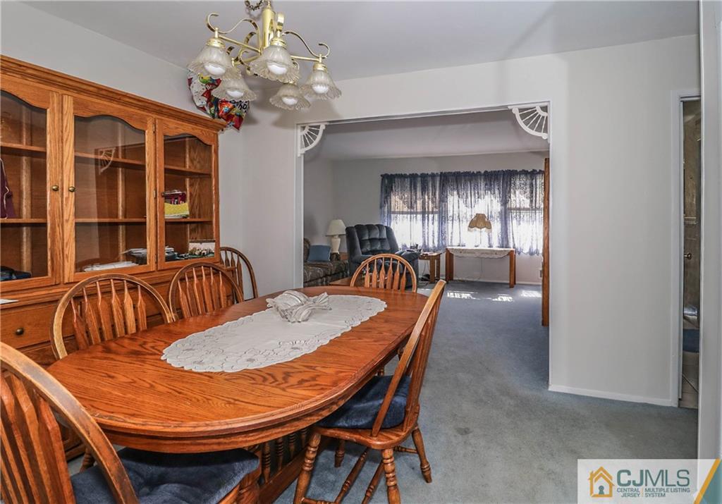 24 Purdue Road Old Bridge, NJ 08859 - Photo 14 of 25 a dining room with furniture a chandelier and window