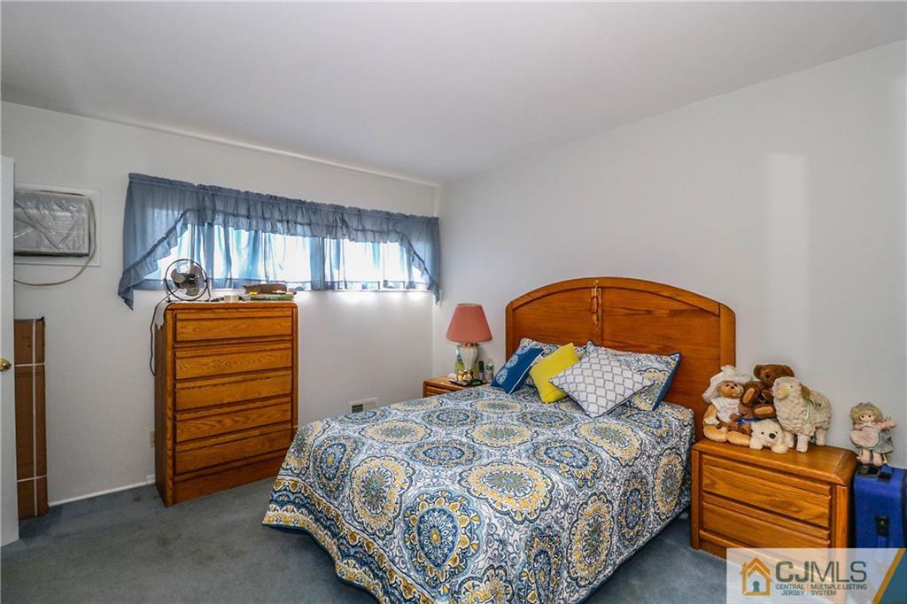 24 Purdue Road Old Bridge, NJ 08859 - Photo 15 of 25 a bedroom with a bed and a dresser
