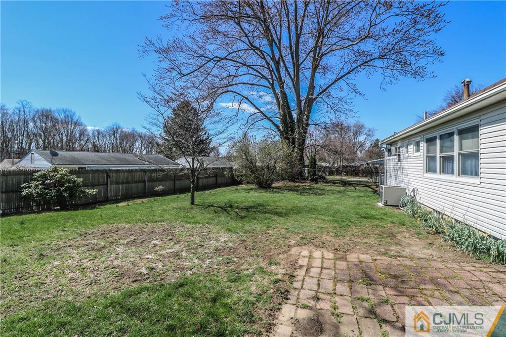 24 Purdue Road Old Bridge, NJ 08859 - Photo 24 of 25 a view of a backyard with large trees plants and large tree