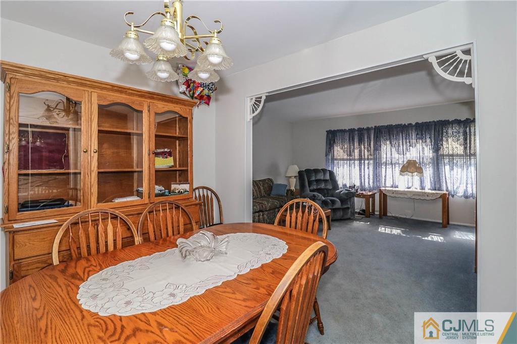 24 Purdue Road Old Bridge, NJ 08859 - Photo 9 of 25 a view of a dining room with furniture and chandelier